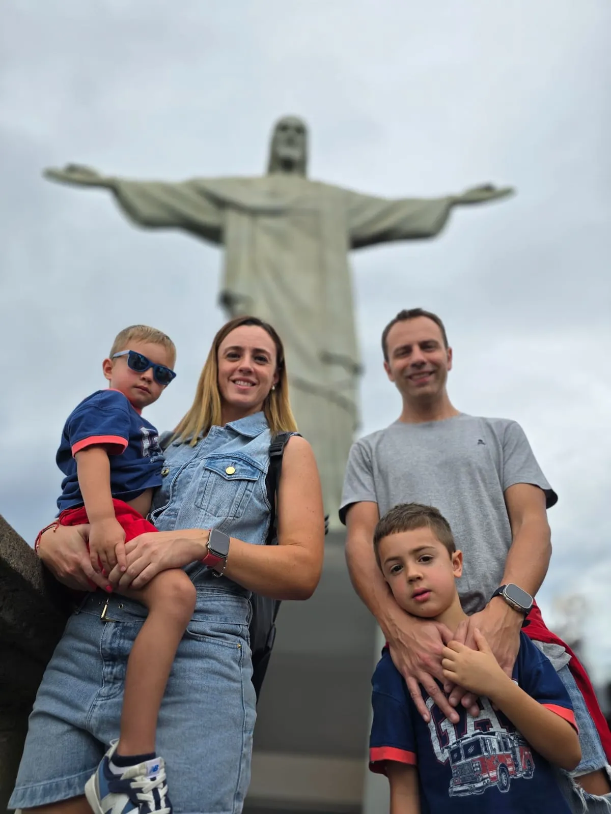 a family in front of christ the redeemer