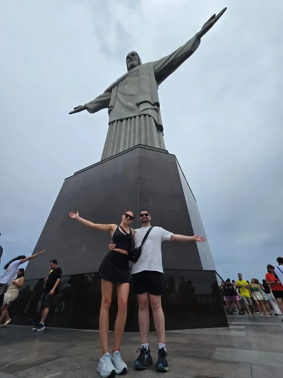 couple at christ the redeemer enjoying rio de janeiro