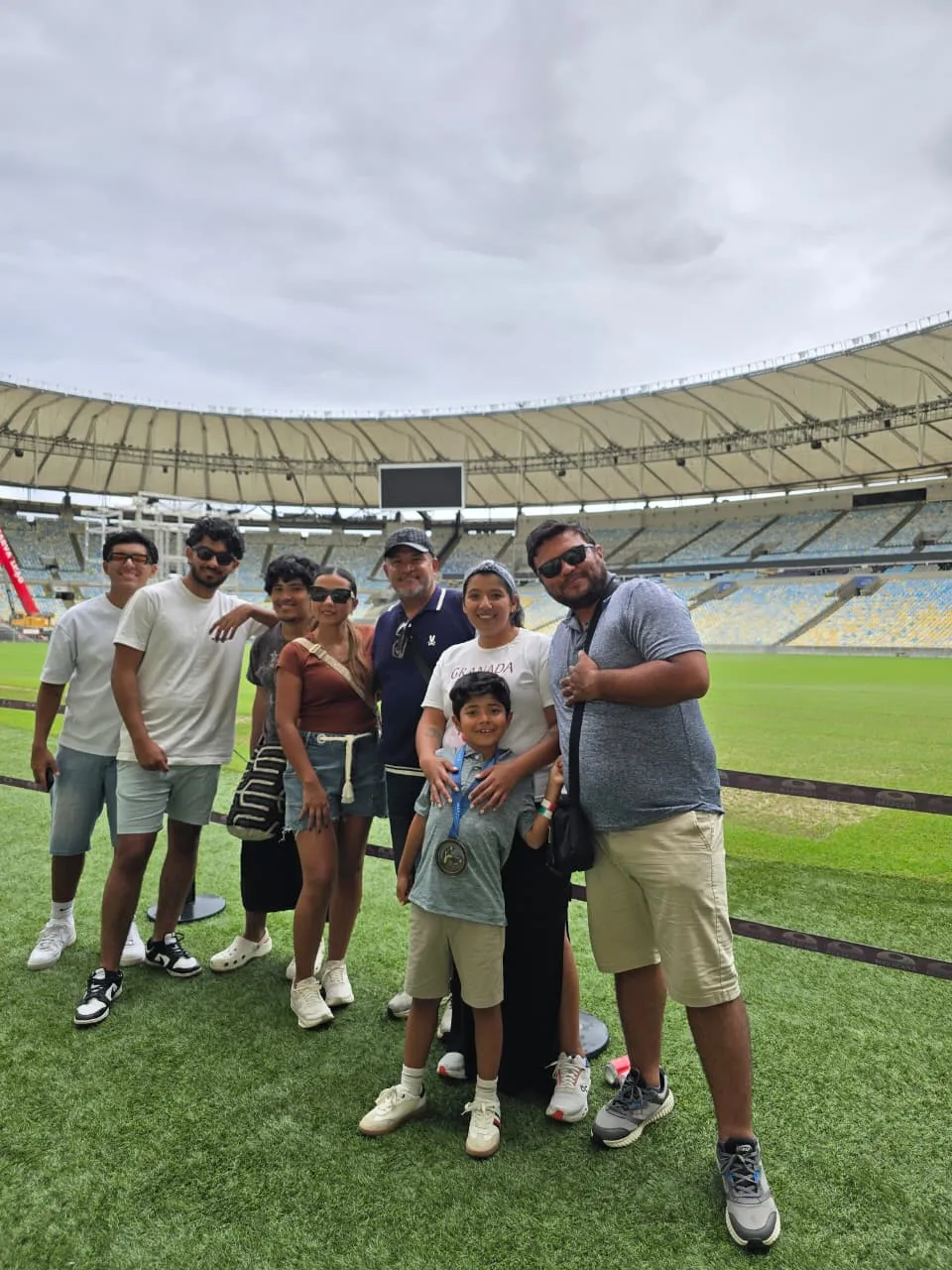 family at the maracana footbal stadium field