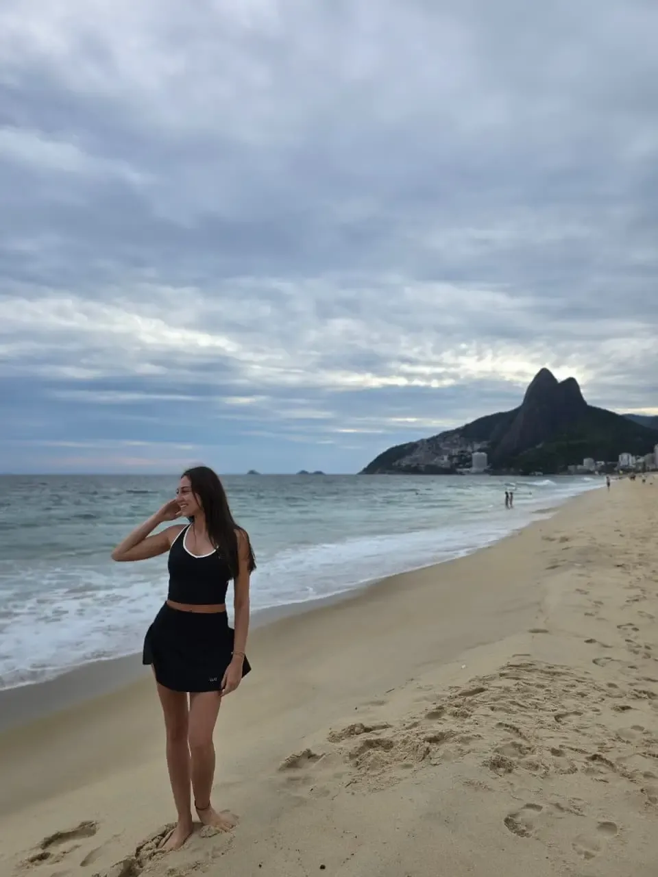 traveler on ipanema beach with two brothers mountain
