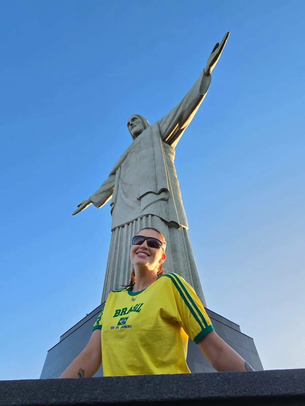 woman at christ the redeemer golden hour view