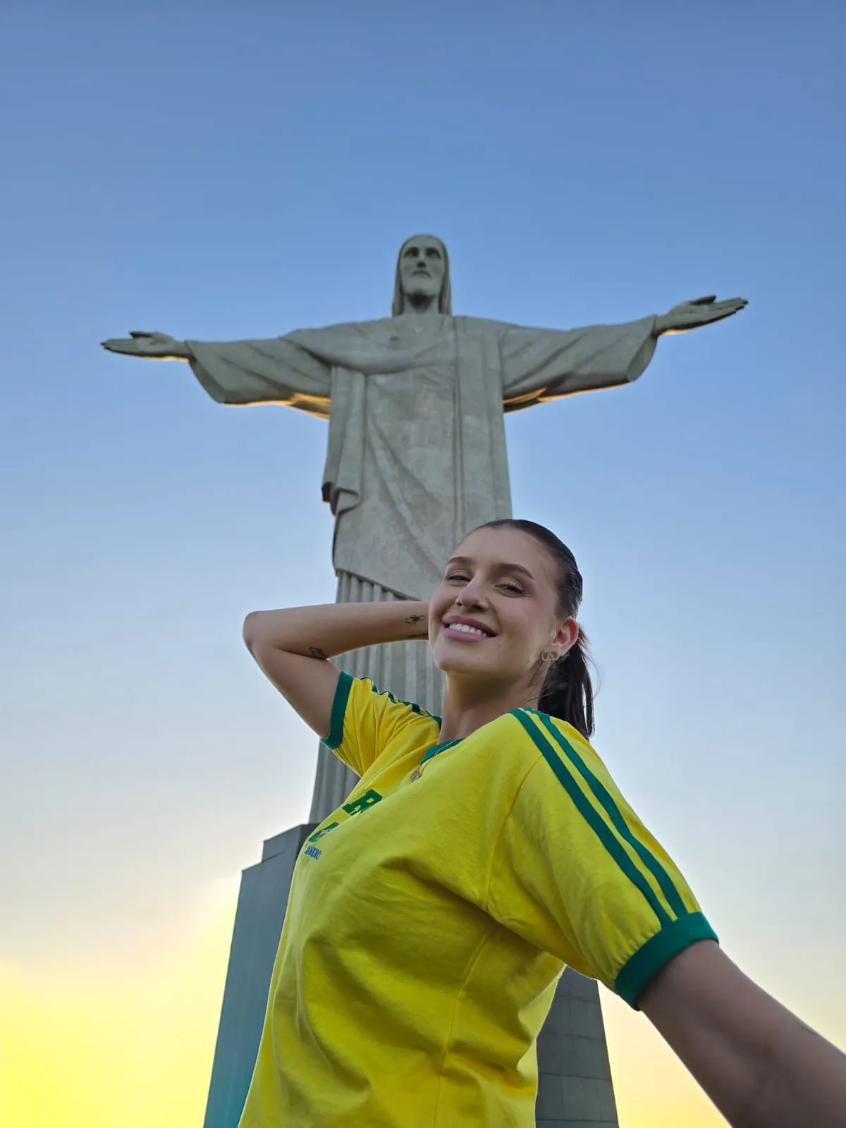 woman at christ the redeemer golden hour